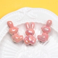 Detail of pink pearlescent rabbit beads with iridescent finish for DIY crafts - 3mm Hole / Peach
