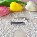 Detail view of 4.8cm polished silver metal hair clips on a decorative lace background - Electroplated Silver