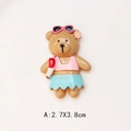 Detailed macro view of a cute resin bear charm wearing summer beach outfit for DIY crafts - Swimming Ring Bear