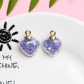 Transparent heart pendant with purple star sequins and golden metal ring attachment - 1.8 x 2.4cm / Purple