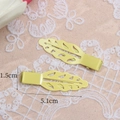 Set of two 5.1cm leaf-shaped hair clips in bright yellow finish with duckbill design - Hollow Leaf Style (MG-S7050) / Yellow