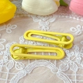 Set of two yellow matte finish 6cm duckbill hair clips on white lace background - Matte Yellow