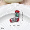 Gros plan d'une breloque chaussette de Noël pailletée argentée avec bordure rouge - Argent Chaussette de Noël