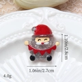 Vue détaillée d'une figurine de Père Noël en résine pailletée pour accessoires DIY - Père Noël Argenté Avec Drapeau