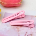Pink candy-colored U-shaped hair clips with glossy finish and serrated grip design - Light Pink