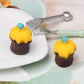 Macro shot of miniature star cupcakes with yellow cream for dollhouse DIY decor - Yellow