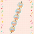 Detailed macro view of five acrylic Christmas beads with orange core and Bells text pattern - Orange With Bells