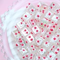 Macro view of cube Aurora beads with white flower patterns for DIY jewelry making - 18mm / Transparent Square + White Bow + Red Dot