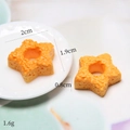 Stervormige harsbedel in oranje voor DIY-haarspelden en knutselen met imitatievoedsel - Sterkoekje