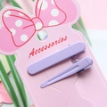 Purple matte metal hair clip set on accessory card with decorative green leaves - Purple