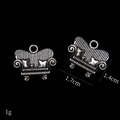 Macro shot of 1.7cm mini vintage silver alloy sofa charms for jewelry making - Sofa