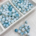 Macro detail of blue and white marble glass beads with polished ice crackle texture - 100pcs Pack / Ink Wash - Cyan Blue