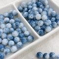 Macro shot of 8mm ink-style gradient glass beads for jewelry making DIY projects - 100pcs Pack / Ink Wash - Navy Blue