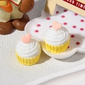 Detail of DIY miniature resin cupcakes with white cream and pink hearts on a cute tray - Yellow Bottom Pink Heart