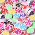 Macro shot of colorful spiral polymer clay marshmallow charms for DIY craft decorations - Round Mixed Colors