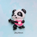 Macro view of panda resin charm with pink guitar for DIY crafts and phone case deco - Panda With Rose Guitar