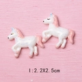 Close-up of a white and pink resin unicorn charm with blue glitter and size measurement - 2.2X2.5cm / Q-Style Pink Mane Unicorn (I)