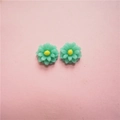 Macro view of mint green resin daisy charms with yellow stamen for DIY jewelry making - Small Style / Pink and Green
