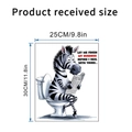 Detailed view of zebra reading newspaper toilet sticker with 25x30cm dimensions - Zebra