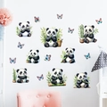 Detail of cute panda and butterfly wall stickers applied on a white nursery room wall - Panda Eating Bamboo (KS6832)