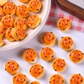 Macro shot of miniature resin bread dollhouse decor with detailed orange spiral texture - Sesame Swirl Bread
