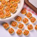 Macro shot of miniature resin pizza bread charms for DIY dollhouse crafts and decor - Sausage Scallion Square Bread