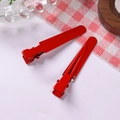 Detail of red metal alligator hair clips with a smooth matte finish for DIY hair accessories - Burgundy