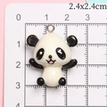 Cute 3D resin panda pendant with metal ring measuring 2.4x2.4cm for DIY keychains - Tongue-Out Laughing Panda