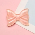 Close-up of translucent pink resin bow accessory with silver glitter for DIY crafts - 2.1x2.8cm / Light Pink Glitter