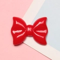 Macro detail of glossy red resin polka dot bow for DIY crafts and phone case decor - 2.1x2.8cm / Red