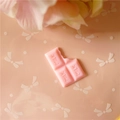 Detailed macro view of a pink chocolate resin charm with MILK text for DIY crafts - Large / Pink