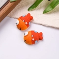 Detailed view of orange resin clownfish charms with blue dots for DIY shoe decoration - Sold by Piece / Orange