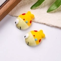 Detailed view of two cute resin clownfish charms for DIY crafts and shoe decoration - Sold by Piece / Yellow