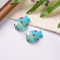 Macro detail of cute resin clownfish charms with blue dots for DIY shoe buckles - Sold by Piece / Blue
