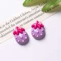Detailed view of purple resin strawberry charms with white dots and pink flower accents - Purple Single Sale