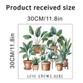 Muursticker groene planten aquarel 30x30cm met tekst Love Grows Here decoratie - Aquarel Illustratie In Pot Met Warme Slogan (KSY247D) / 30x30cm
