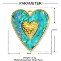 Detail view of heart pendant with green marble resin texture and gold-plated stainless steel - Medium / Cyan Heart Style (YF977-3)
