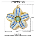Detailed view of a 23mm blue enamel flower pendant with natural green stone in gold steel - Medium / Light Blue Flower Style (YF978-3)