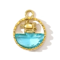 Macro shot of gold turtle pendant with blue faceted crystal in a round grooved frame - Turtle Design (Gold)