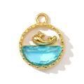 Macro detail of a golden whale charm inside a blue crystal ring pendant on white background - Whale Design (Gold)