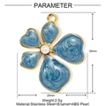Detailed view of a gold-framed blue enamel flower pendant with a white pearl center - Blue Swirl Pearl Flower (YE1167)