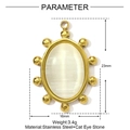 Macro view of gold stainless steel oval pendant featuring a white cat eye stone center - Oval Bead Style (YE1491)