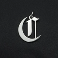 Detailed macro view of silver polished Old English letter C pendant with crescent element - Letter C