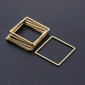 Close-up of minimalist golden square stainless steel frames for DIY jewelry making - Square Style (T935) / Gold