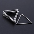 Macro shot of silver stainless steel triangle jump rings for DIY jewelry making - Silver
