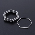 Macro shot of silver hexagon stainless steel geometric pendants for DIY jewelry making - Hexagon Style (T937) / Silver