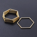 Macro detail of hexagonal gold titanium steel DIY jewelry links for pendant making - Hexagon Style (T937) / Gold