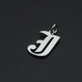 Macro view of Gothic letter J pendant in polished silver stainless steel for DIY jewelry - Letter J