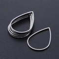 Detailed macro view of silver teardrop hollow stainless steel jewelry frames for DIY crafts - Water Drop Style (T941) / Silver