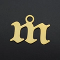 Macro shot of Gothic letter M gold plated stainless steel charm with mirror finish - Letter M (JA570-M)